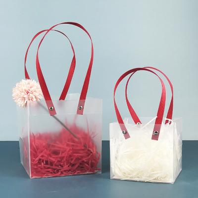 China 2022 Disposable Stylish Translucent Plastic Handbag Waterproof Transparent Shopping Bags Free Sample for sale