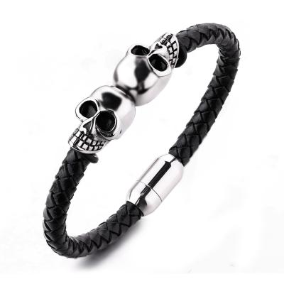 China Fashion jewelry custom engraved leather bracelet stainless steel magnetic clasps leather men skull bracelet for sale