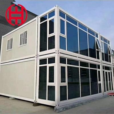 China Steel Flat Pack House Coffee Shop Prefab Chalet in Wood with Anti-Quake Sandwich Panel for sale