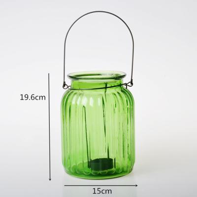 China Most popular candle holder eco-friendly glass wedding food grade decorative glass candle holder with handle for sale