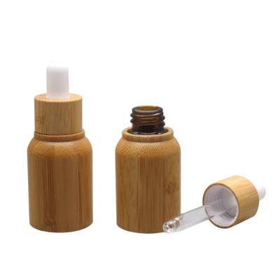 China Personal Care Round Matte Black Glass Essential Oil Serum Bamboo Dropper Bottle With Pipette 10ml for sale