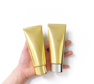 China 100g Personal Care Tube Empty Plastic Soft Facial Massager Tube Refillable Cosmetic Squeeze Cleansing Tubes With Gold Lids for sale