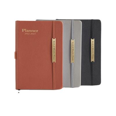 China 2023 Simple Daily Monthly Planner Journal A5 Office Style PU Strap Leather Elastic Agenda Notebook for sale