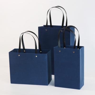 China Recycled Materials Factory Logo Cheapest Blue Handle Printed Kraft Paper Shopping Paper Bag for sale