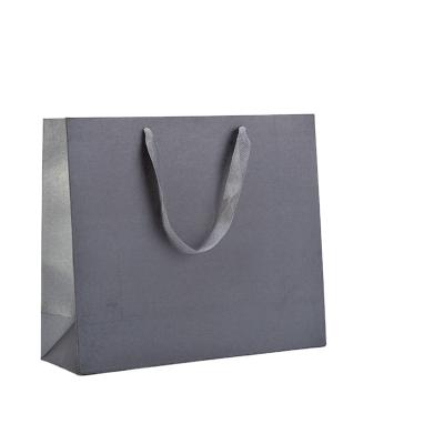 China Recycled Materials Wholesale Custom Large Shopping Bag Clothing Packaging Paper Bags for sale