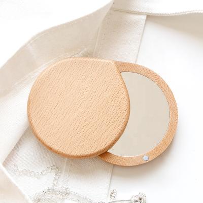 China Personalized Cosmetic Makeup Mirror Convenient Folding Folding Hand Makeup Mirror With Rotating Lid for sale