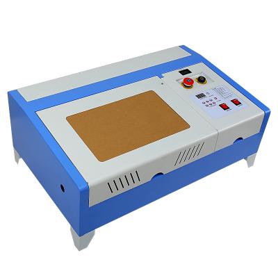 China Laser Engraving 40W Cutting CO2 Laser 3020 Mini Cutter Module Engraving Machine for sale