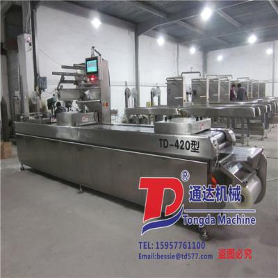 China Fully Automatic Continuous CLOTHING Stretch Film Vacuum Packing Machine for sale