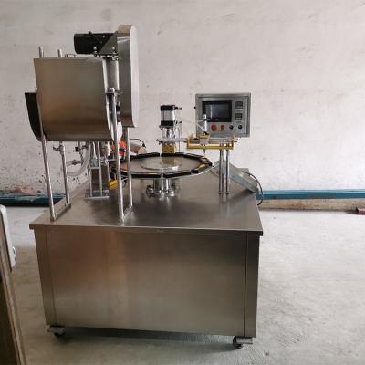 China Rotary Type Honey Spoon Filling Sealing Packing Food Machine for sale