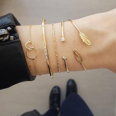 China TRENDY Open Watch Band Set Gold 5Pcs/Set Sun Chain Leaf Crystal Geometry Women Charm Cuff Beach Jewelry Set for sale