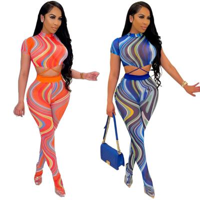 China Anti-wrinkle woman tie dye print crop top 2 pieces see through pants set mesh tights set for women for sale