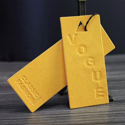 China Sustainable Luxury Wholesale White Cardboard Paper With Debossed Hang Tags For Clothing for sale