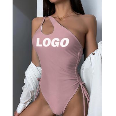 China Breathable Custom Brand Swimwear Bikini One Shoulder Cavity Solid Color Fabric One Piece Eco-Friendly Swimsuit for sale