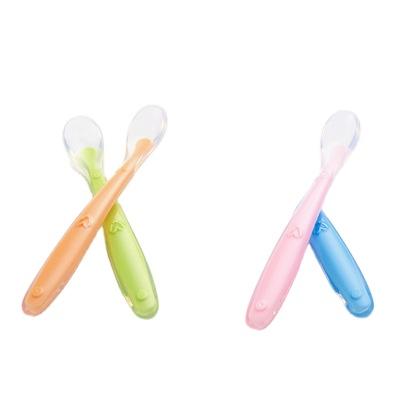 China BPA Free Newborn Training Feeding Soft Silicone Baby Spoon Children Soft Silicone Spoon Candy Color Temperature Feeling Spoon for sale