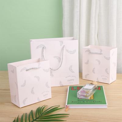 China Recycled Custom Logo White Luxury Paperbag Paper Gift Bag Wholesale Cheap Price Gift Packaging Pouch Materials Bag for sale