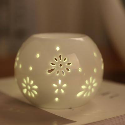 China New Product Modern Simple Essential White Round Flower Aroma Ceramic Oil Burner Wax Melt Burners for sale