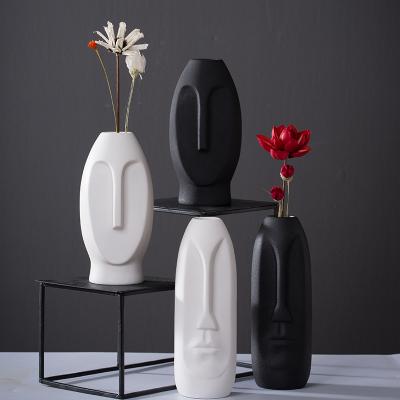 China Nordic Modern Black White Living Room Tabletop Shape Human Face Head Europe Style Porcelain Ceramic Flower Vase For Home Decor for sale