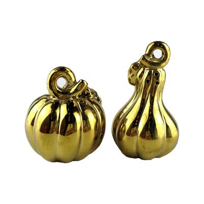 China Sustainable Glod Pumpkin Modeling Ceramic Salt And Pepper Shakers Bottle Set, Spice Jar for sale