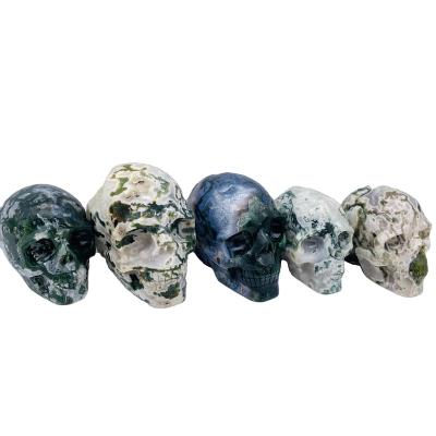 China Europe Wholesale Crystal Crafts Healing Natural Stone Skulls Hand Cut Moss Agate Crystal Skulls for sale