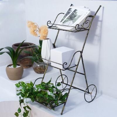 China Indoor and outdoor metal creative trolley to Europe flower rack flower pot plant balcony rack Nordic stand for sale