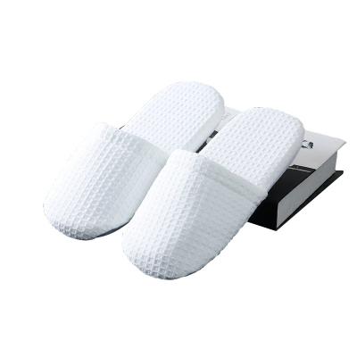 China Top Quality Exquisite Disposable Hotel Amenities Waffle Hotel Bathroom Eco-friendly Slippers for sale