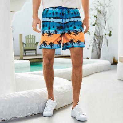 China Custom Anti-wrinkle OEM logo and design polyester sports palm print beach shorts for men for sale