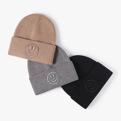 China COMMON Wholesale high quality winter Fall smile Warm custom logo embroidered Knit cap women beanie hats for sale