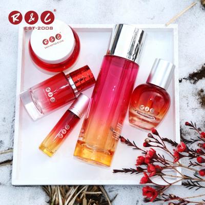 China New Year 250ml 300ml 500ml Travel Size Round Red Sticker Empty Cosmetic Oil Oil Glass Bottle Set For Skin Care Packaging for sale