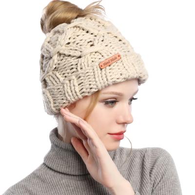 China New Autumn JOINT hot sale women's beanies hat with ponytail hole knitted ponytail hat for sale