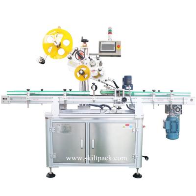 China CLOTHING Automatic Bottle Flat Plastic Lid Labeling Machine for sale