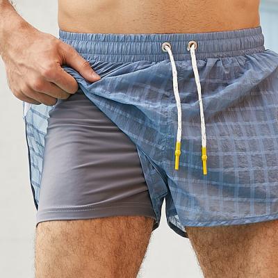 China Anti-wrinkle Mens Plaid Mesh Design Shorts Swimming Trunk Lightweight Custom Compression Shorts for sale