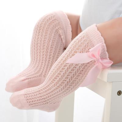 China Antibacterial Spanish Style Babies Knee High Newborn Socks Knit Cotton Tube Ruffled Long Hollow Stockings With Bow Infant Socks for sale