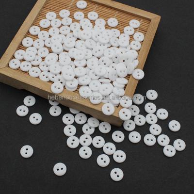 China Viable Non-Instant Wholesale Retail Button Wooden Bags Cushion Accessories Pants Blouse 9/10MM Flatback Sewing 2 Hole White Resin Buttons for sale