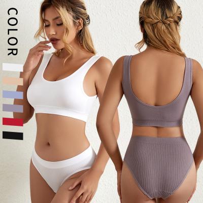 China Custom QUICK DRY logo radio lift up girl underwear sport 2 pieces seamless sexy bra and brief panties sets for women for sale