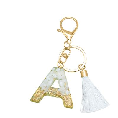 China Resin Initial Charm Alphabet Letter Resin Key Chain Gold Glitter Tassel Key Chain Key Chain Pendant Women Gifts for sale