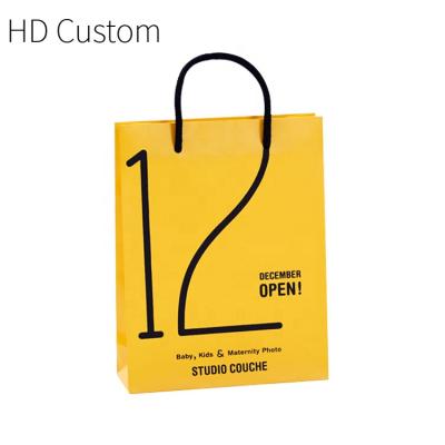 China Yiwu Recyclable Custom Yiwu Yellow Paper Rope Flat Bottom Handle Gift Bag Yelow Bioldegradable Your Logo Lingere Packaging Zhejiang Bags for sale