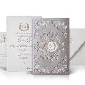 China Luxury Cotton Paper Wedding Invitations Flourished Laser Cut Sleeves With Gold Pattern for sale