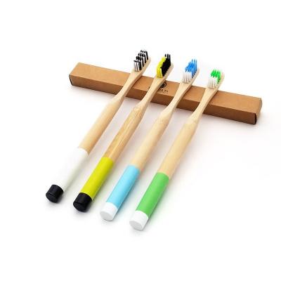 China Disposable double color round bamboo toothbrush with private logo for sale