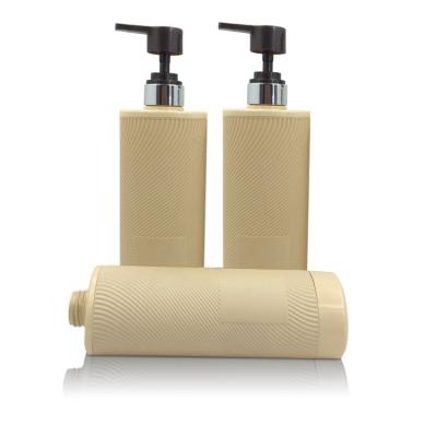 China Eco Friendly Cosmetic Packaging Yellow HDPE 720ml Shampoo Bottle With Pump for sale