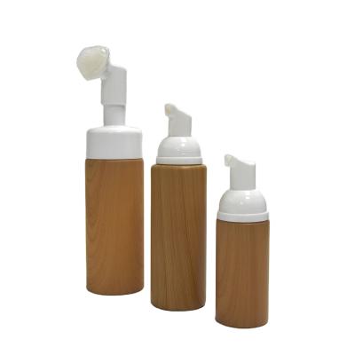 China 50ml 100ml 150ml Cosmetic Packaging Cosmetic Facial Massage Cleanser Plastic Foam Foam Bottle With Brush for sale