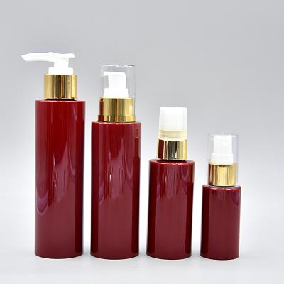 China Cosmetic Packaging 130ml 110ml 65ml Flat Shoulder Red Collection Set PET Plastic Lotion Pump Bottles Cosmetic Skin Care Package Bottle for sale