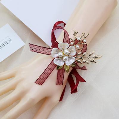 China Wholesale Hot Selling Hand Ribbon Wedding Bridesmaid Realistic Silk Bridal Handmade Flower Pearl Wrist Ribbon Flower for sale