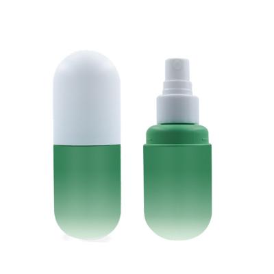 China Custom Cosmetic Pill 50ml 60ml 100ml Color Packing Capsule Shaped Plastic Bottle With Spray Or Lotion Pump for sale