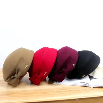 China Fashion in Quality Running Women Fashion Solid Winter Wool Female Beret Hat with Bow for sale