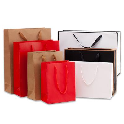 China Recyclable Custom Printed Brown Kraft Paper Shopping Bag With Handles Paper Bags With Your Own Logo for sale