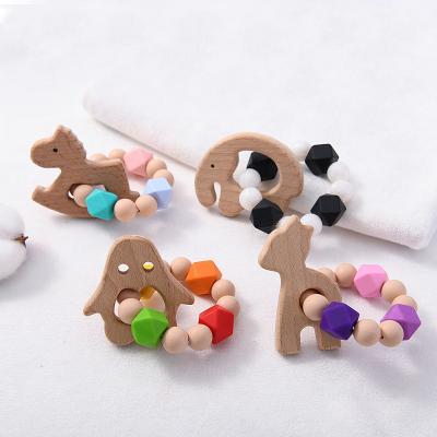 China Soft Toy New Design Sensory Baby Teething Toys Ratchet Soft Wooden Baby Teether Ring Kids Food Grade Silicone Bpa Teether for sale