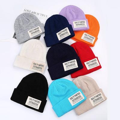 China Wholesale JOINT Acrylic Slouchy Cuff Woven Label Ski Cap, Mix Skull Knit Winter Hat Custom Beanie for sale