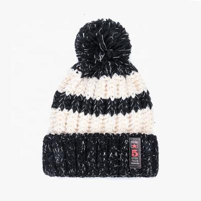 China COMMON Wool Beanie Hat Fleece And Thick Fashion Winter Warm Knitted Beanie Hat With Pom Pom for sale