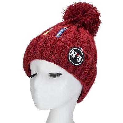 China Winter COMMON Fashion Handsome Beanie Sweet Warm Knitted Beanie Hat With Pom Pom for sale