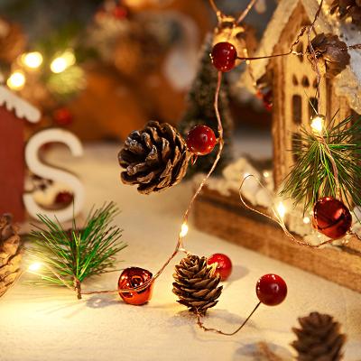 China Christmas light with pine cone Christmas garland decoration with lights pine cones red fruit led copper wire lights pine needles rattan string lights for sale